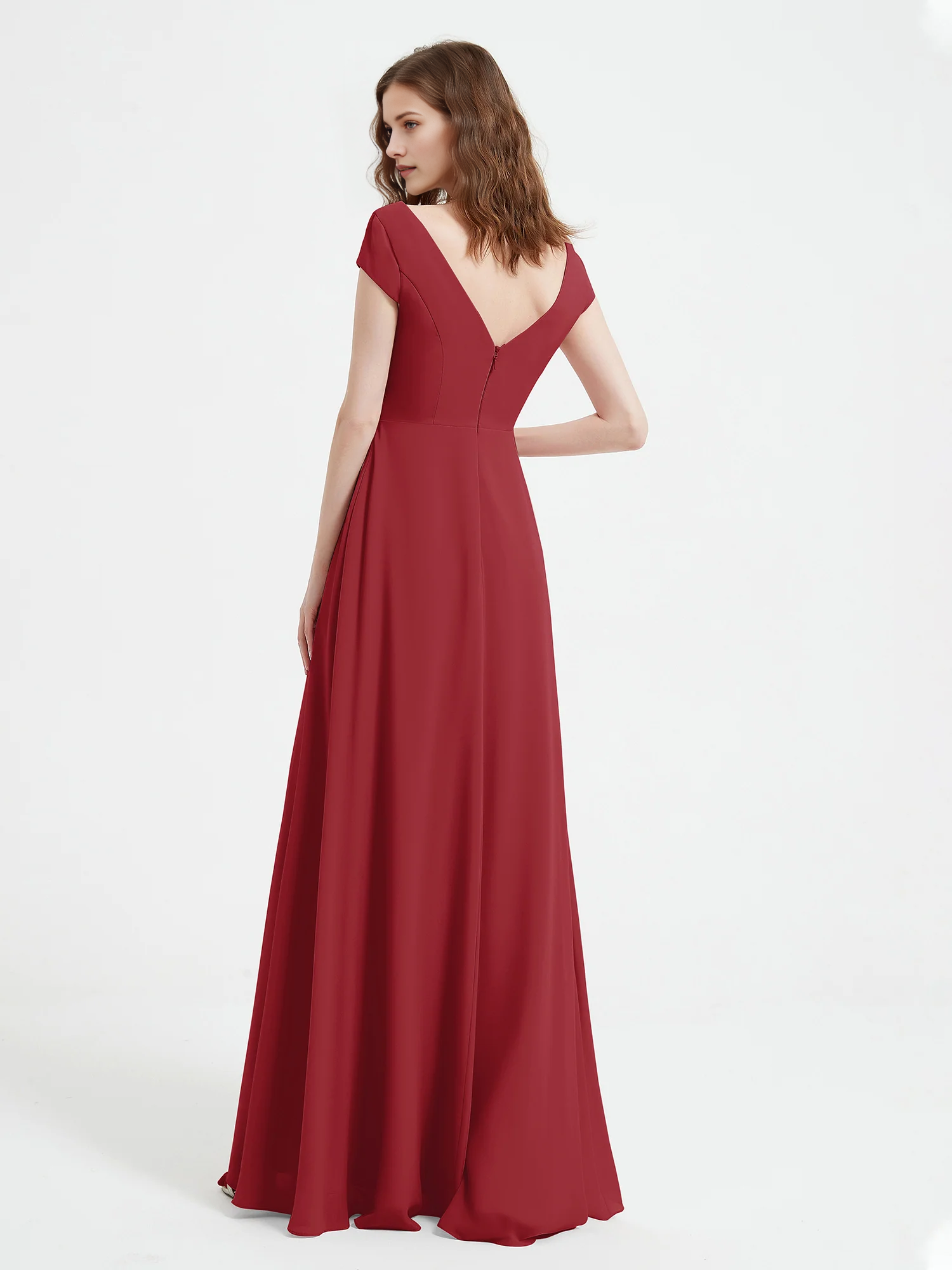 Back view of a V-back cap sleeve bridesmaid dress with zipper closure and flowing floor-length skirt by VEDRESS